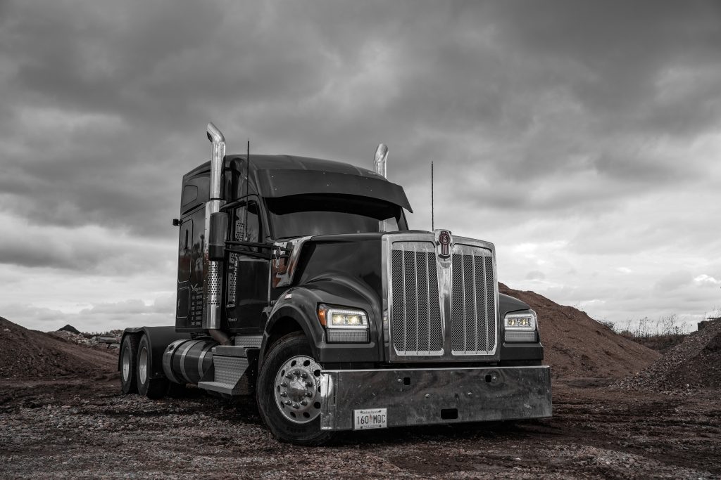 2023 grey Kenworth W990 with BTS Lighting Bi-Beam LED headlights amber light output