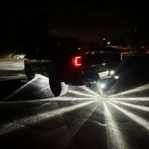 Alpha Series Lighting Glass is Class watermelon lights installed underneath a 4th gen Ram 1500