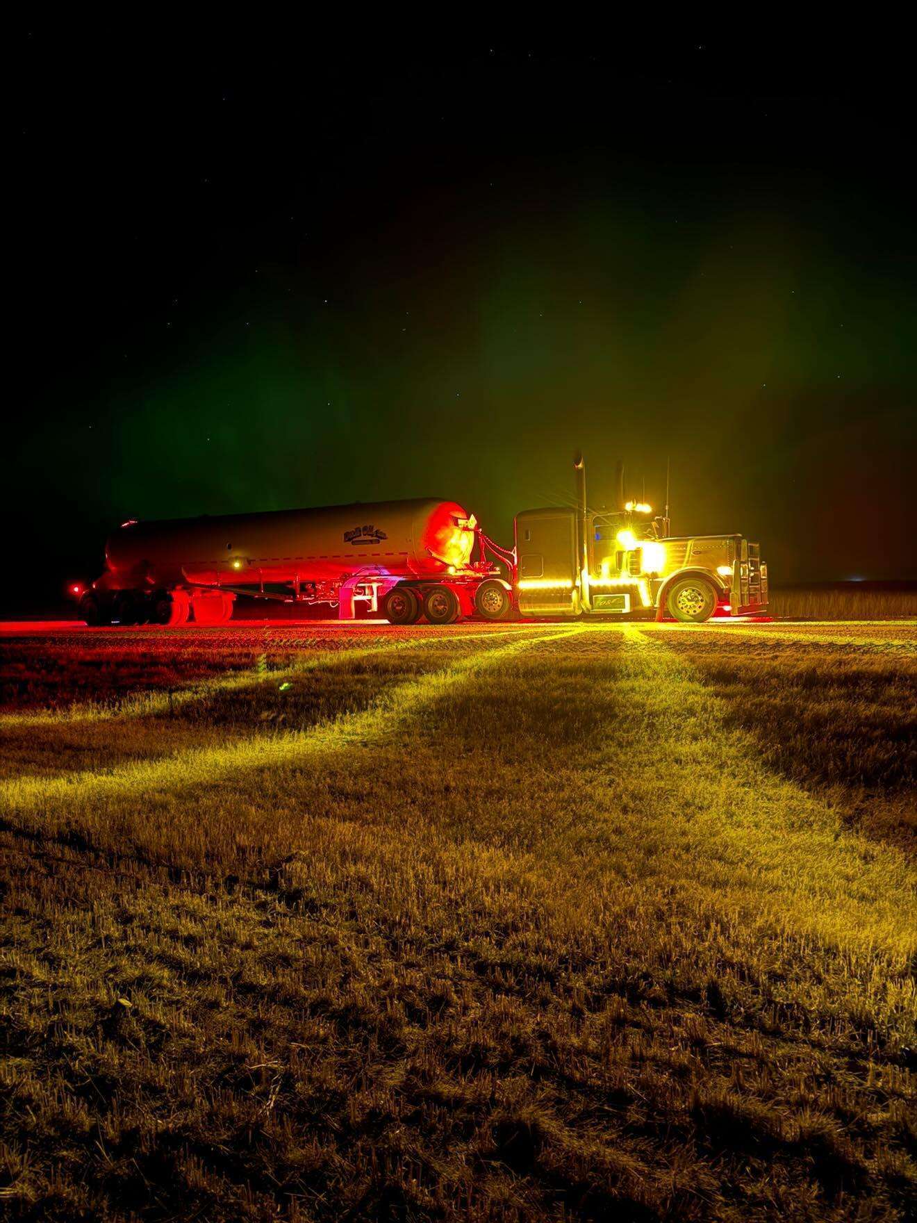 A Peterbilt side view of the amber glass is Class watermelon lights on the mirrors, throwing a big star pattern into the ditches