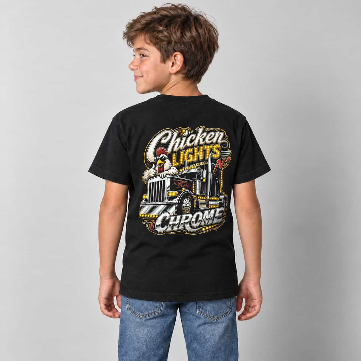 Bts Lighting Kids | Chicken Lights Tee | Heavy Weight Cotton Tee 4 Child wearing the black BTS Lighting kids' Chicken Lights T-shirt, showing the chicken and truck graphic on the back.