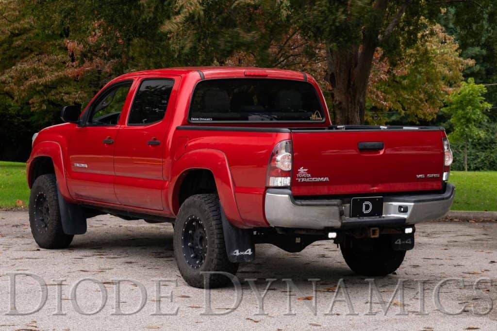 Diode Dynamics Stage Series Reverse Light Kit For 2005-2015 Toyota Tacoma C2 2.0 36 Manufacturer Tacoma mounting photograph showing the compact two-inch pod location. Current C2 2.0 kit contents are shown separately.