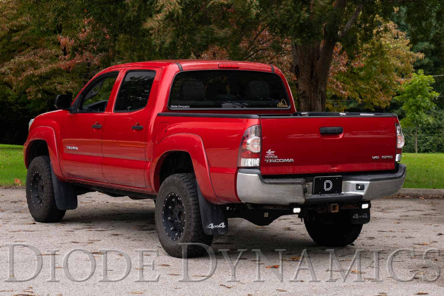 Manufacturer Tacoma mounting photograph showing the compact two-inch pod location. Current C2 2.0 kit contents are shown separately.