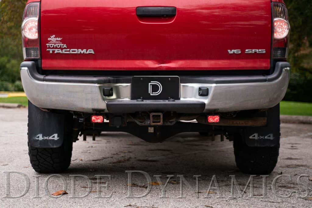 Diode Dynamics Stage Series Reverse Light Kit For 2005-2015 Toyota Tacoma C2 2.0 29 Red accent backlights on a 2005–2015 Tacoma. Installation photo shows the earlier two-inch pod housing; current kit is C2 2.0.