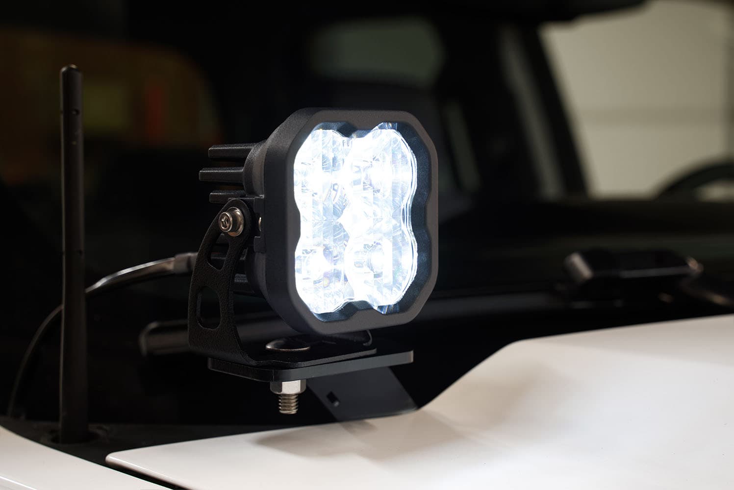 Diode Dynamics Ss3 Led Ditch Light Kit For 2014-2019 Silverado/Sierra 5 SS3 white main beam at the GMC hood corner; tier is not identified.