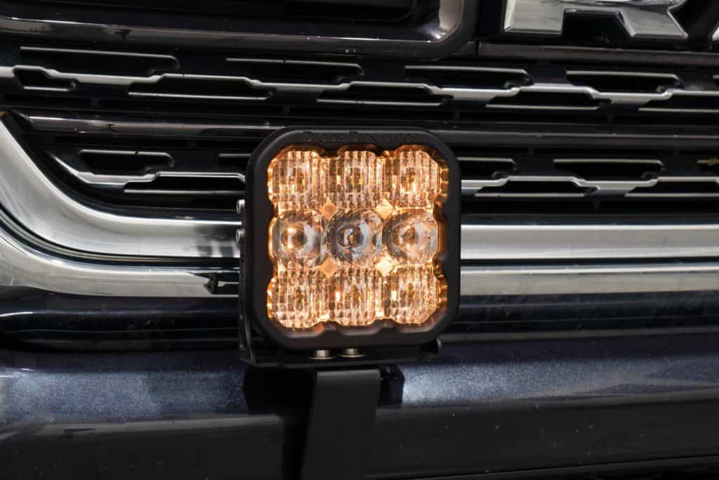 Diode Dynamics Ss5 Bumper Led Pod Light Kit For 2019-2024 Ram 53 SS5 Amber backlight operating in the Ram bumper. White versions have selectable colours; Yellow versions have Amber only.