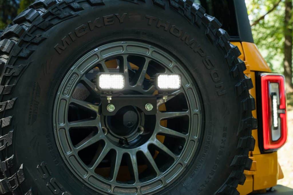 Diode Dynamics Stage Series Reverse Light Kit For 2021-2025 Ford Bronco C2 2.0 40 Bronco two-inch reverse-light mounting and white-light demonstration. This installed photograph does not measure current C2 2.0 output.