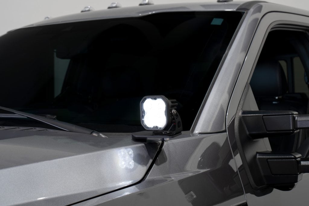 Diode Dynamics Stage Series Ditch Light Kit For 2017-2022 Ford Super Duty Ss3 58 SS3 white main beam at the Super Duty hood corner; tier is not identified.