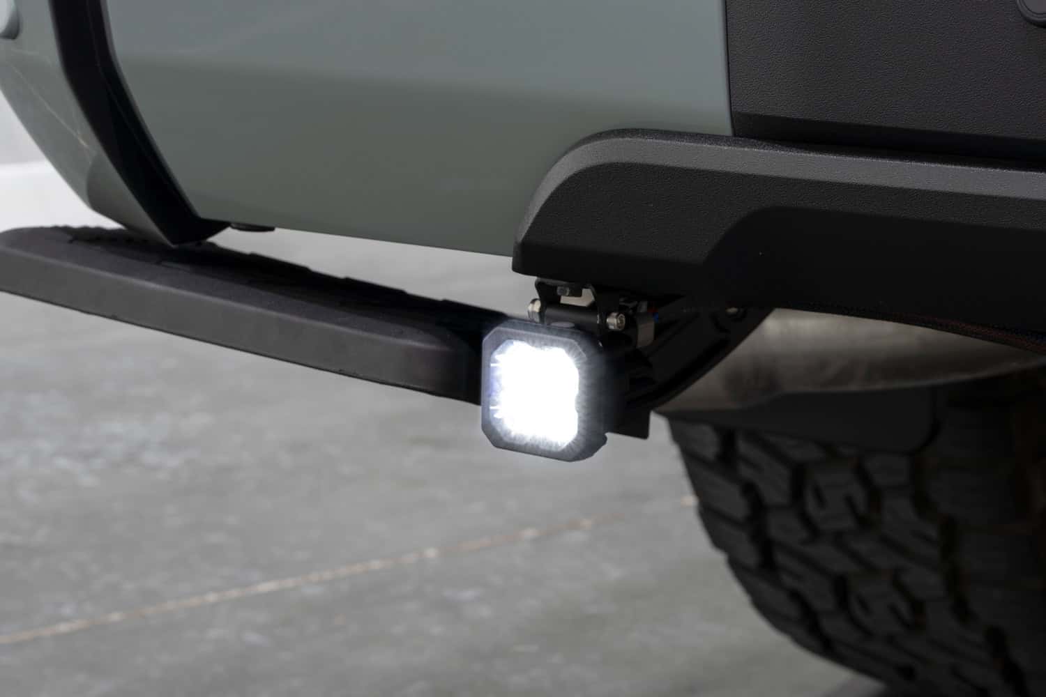 C1 pod mounted below the Tundra rear bumper with the white reverse light on.