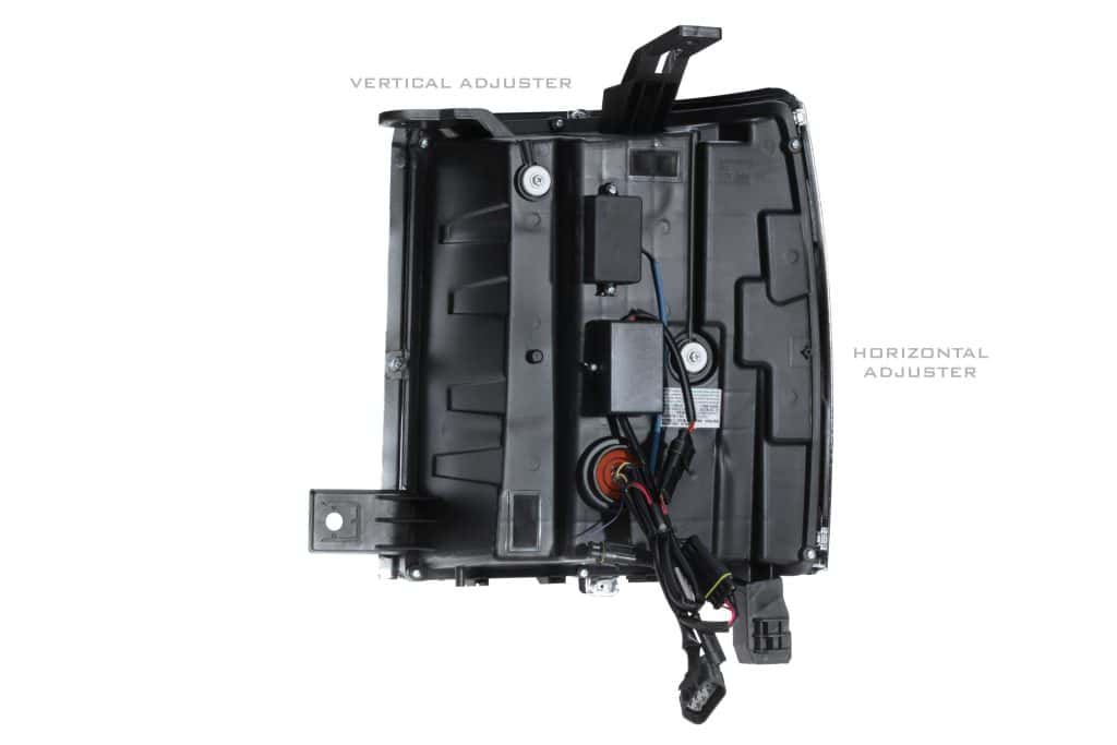 Rear housing with vertical and horizontal aiming-adjuster locations