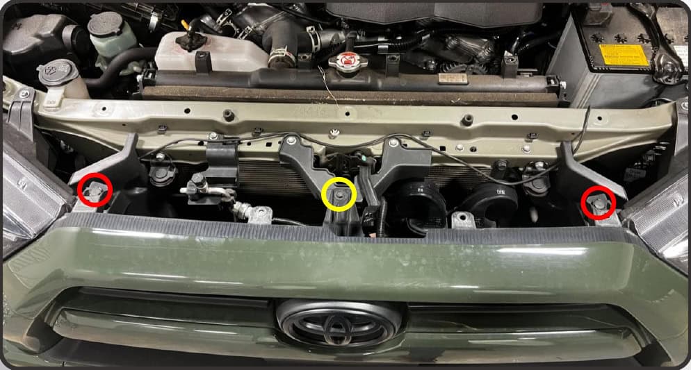 2014–2024 Toyota 4Runner Xb Evo &Amp; Evo Hybrid Installation Guide 4 Remove the two grille clips and central 10 mm screw.