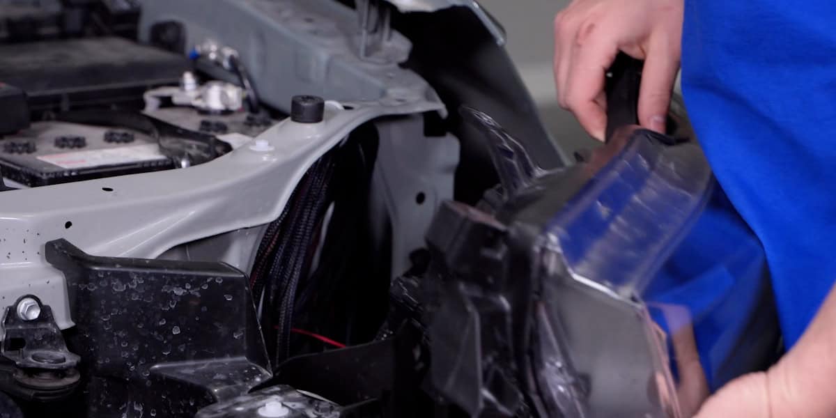 2014–2024 Toyota 4Runner Form Headlight Installation Guide 14 Disconnect and lift out each factory lamp.