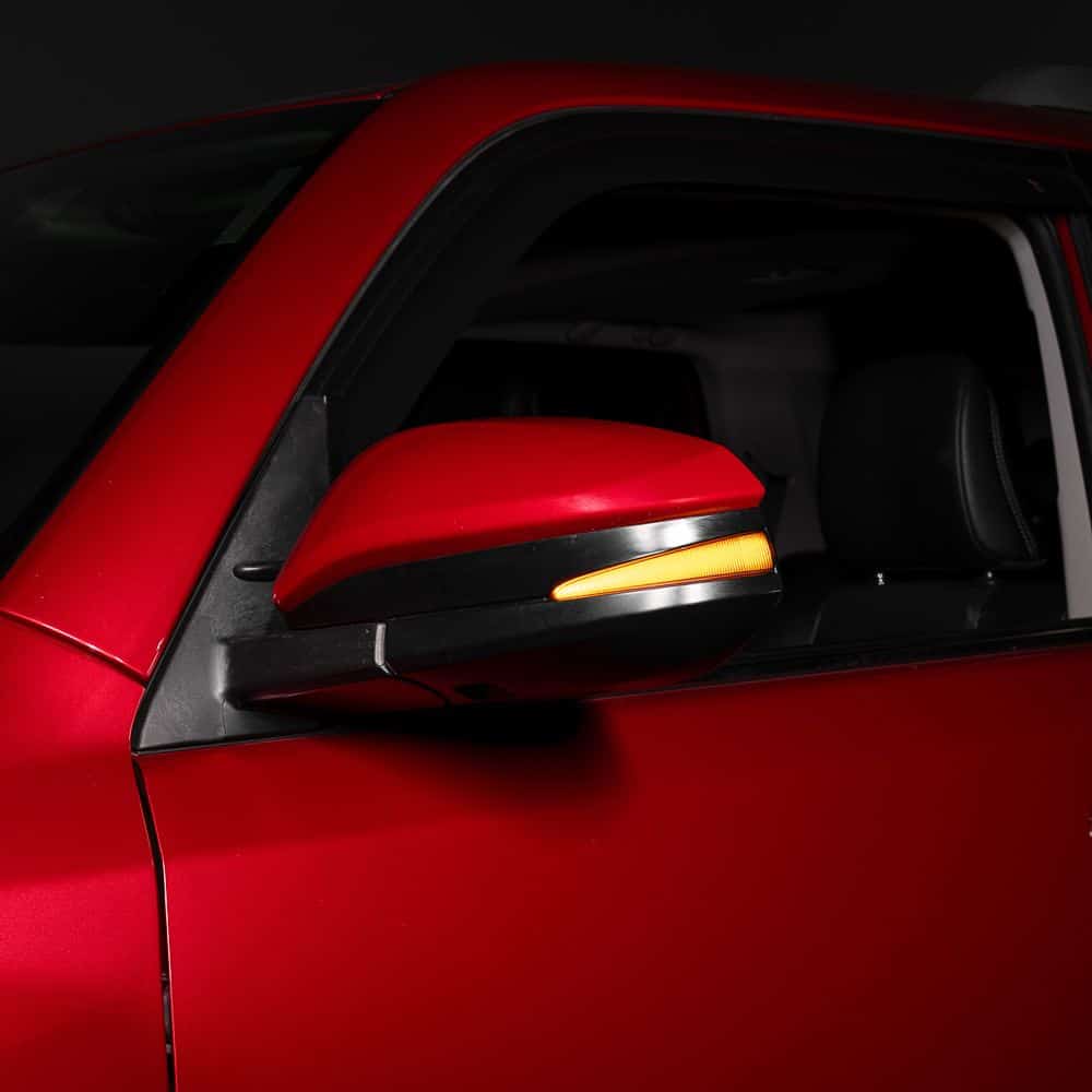 Form Sequential Led Mirror Lights For Toyota 4Runner / Rav4 (Pair) 13 FORM smoked mirror lamp with its amber turn signal illuminated.