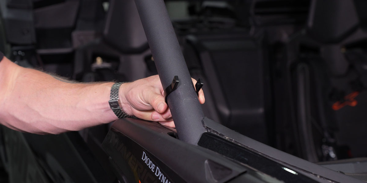 Can-Am Maverick X3 A-Pillar Light Installation Guide 1 Slide the roller-mount ring over the factory roll cage.