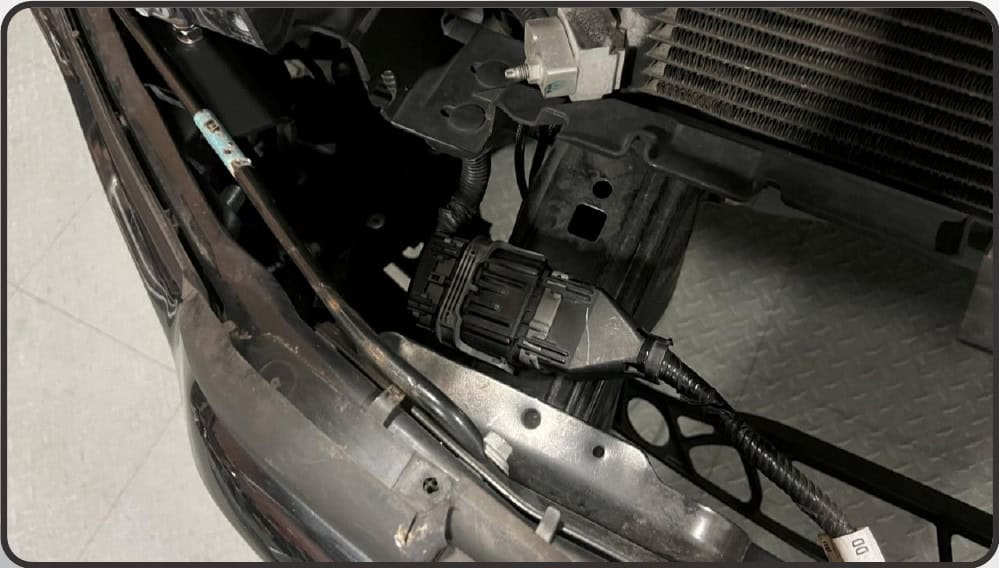 2021–2023 Ford F-150 Morimoto 4Banger Fog Light Installation Guide 29 Morimoto installation illustration: route the harnesses and refit the bumper (5 of 5).