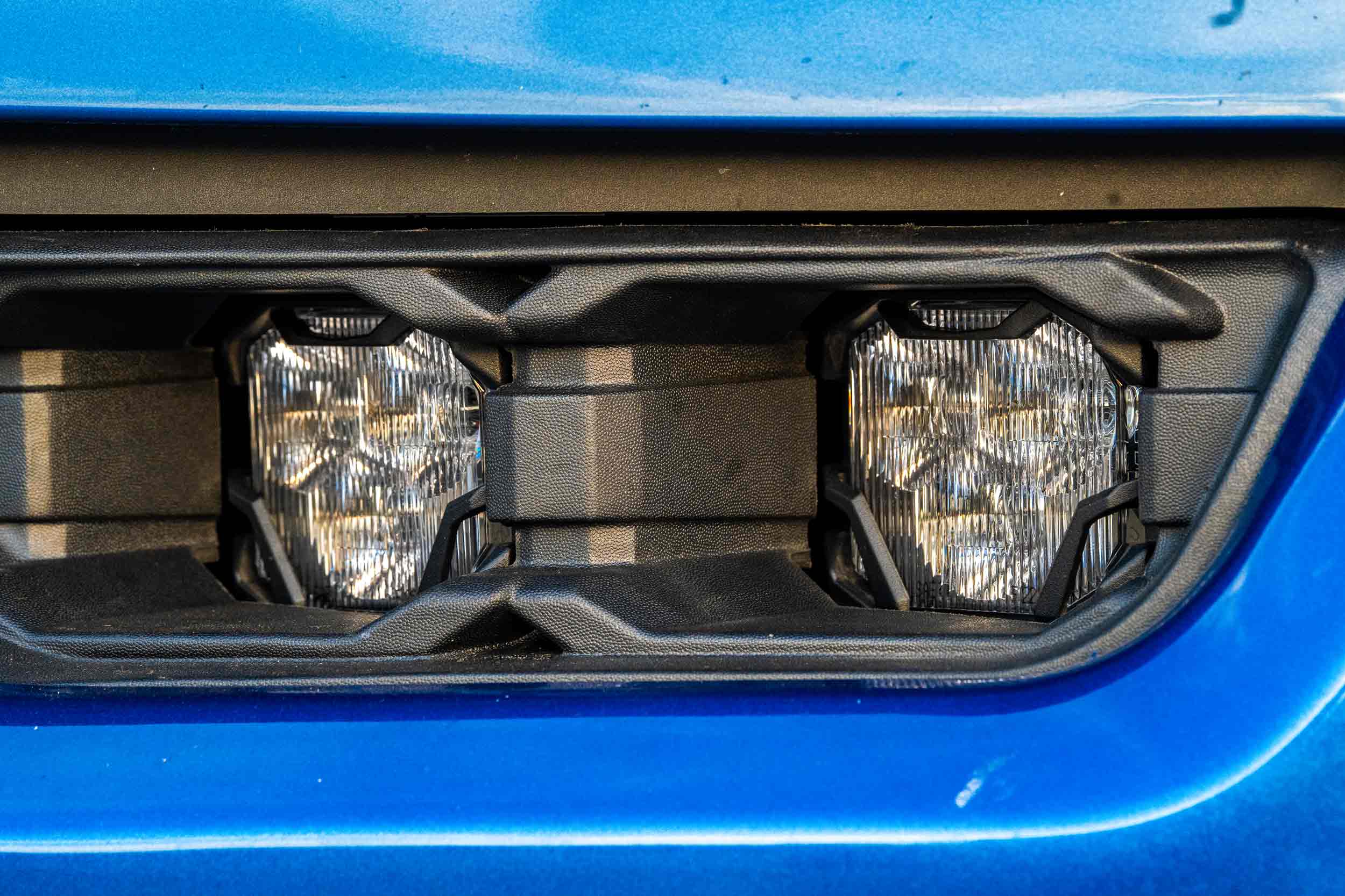 Morimoto 4Banger Dual Fog Light Kit For 2021–2023 Ford F-150 127 Two white 4Banger pods fitted behind the vehicle-specific bezel.