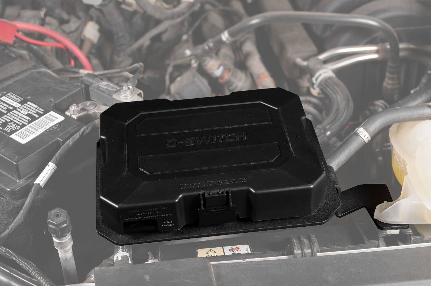 Diode Dynamics D-Switch Hub Mounting Kit For 2021-2026 Ford F-150 5 D-Switch hub on the F-150 engine-bay bracket; hub is included with DD8783 only.