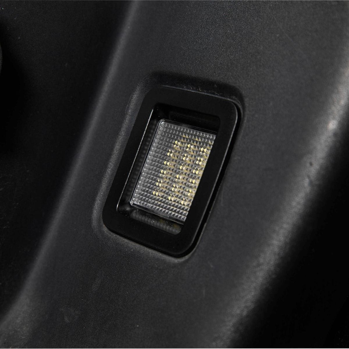 Form Led License Plate Lights For 2015–2023 Ford F-150 (Pair) 3 The clear lens and housing with the lamp switched off.