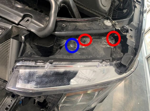 How To Plan A 2021–2023 Ford F-150 Lighting Upgrade 15 Annotated F-150 factory headlight photo with the upper fasteners circled