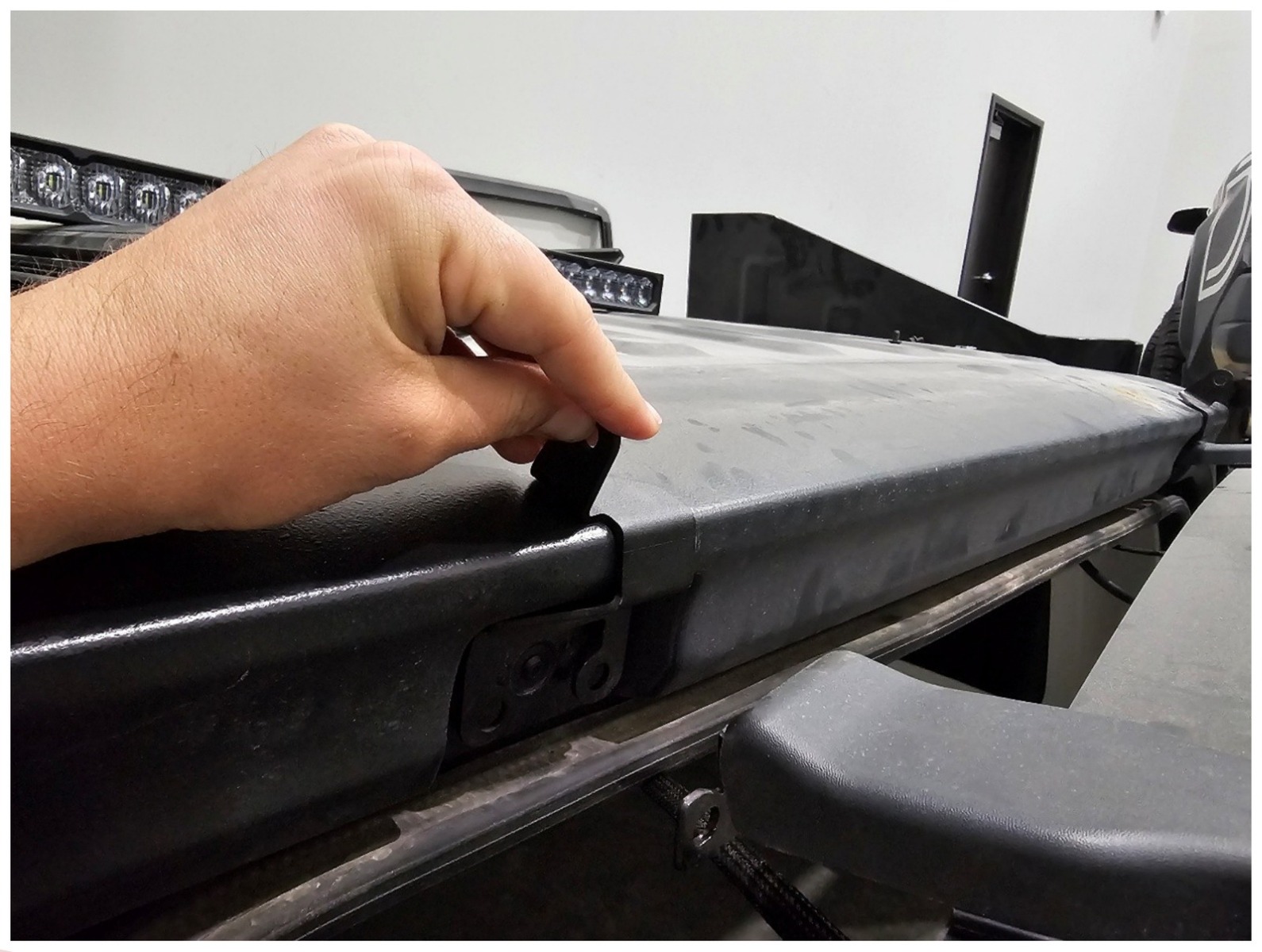 Jeep Jl Rear Hardtop Ss30 Light Bar Installation 2 Position the driver-side bracket. Manufacturer installation photograph.