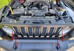 Jeep Jl Ss5 Bumper And Grille Installation Guide 3 Original grille removal photo with outward pull directions marked.
