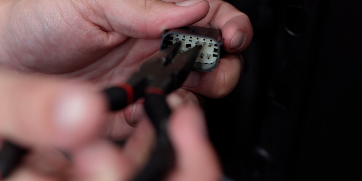 Jeep Jl Form Tail Light Installation 13 Remove the plastic pin separator before releasing the cavity plug.
