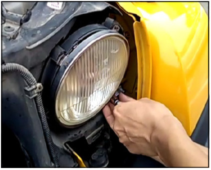 Pro Comp 76402P Jeep Headlight Installation Guide 4 Manufacturer photo: remove the retaining-ring screws.