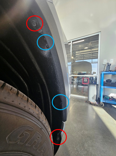 2019–2025 Toyota Rav4 Elite Add-On Fog-Light Installation Guide 3 Wheel-liner fasteners marked at the front wheel opening.