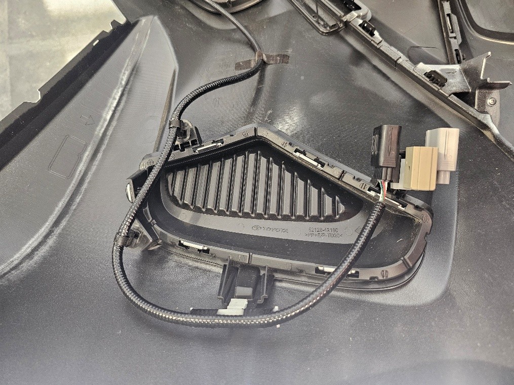 2019–2025 Toyota Rav4 Elite Add-On Fog-Light Installation Guide 7 Release the harness clips behind the original fog-light bezel.
