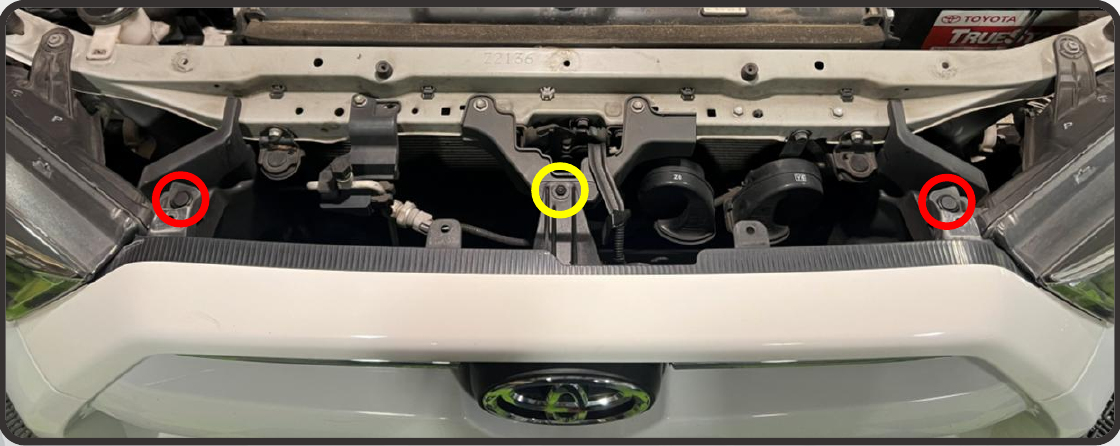 2014–2024 Toyota 4Runner Xbg Grille Installation Guide 4 Remove the two upper grille clips and central 10 mm fastener.