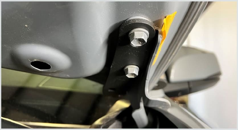 Tacoma Morimoto Ditch-Light Bracket Installation Guide 7 The bracket seats beneath the bolt heads, not between the hinge and hood.