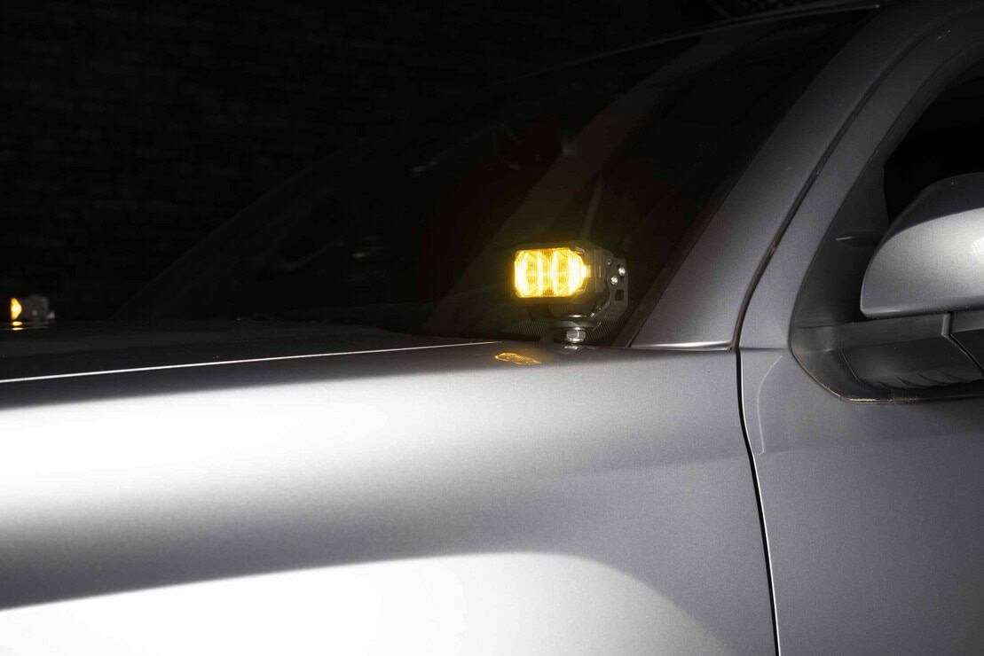 Morimoto 2Banger Complete Ditch Light Kit For 2016–2023 Toyota Tacoma 6 Yellow 2Banger mounted and lit.