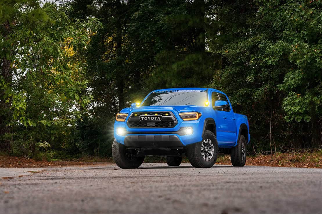 Morimoto 4Banger 2.0 Complete Fog Light Kit For 2012–2023 Toyota Tacoma 10 Tacoma with white fog lights operating.