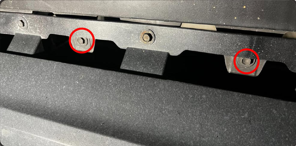 2016–2023 Tacoma Morimoto Evo Headlight Installation Guide 11 Remove the two bolts beneath the middle of the bumper.