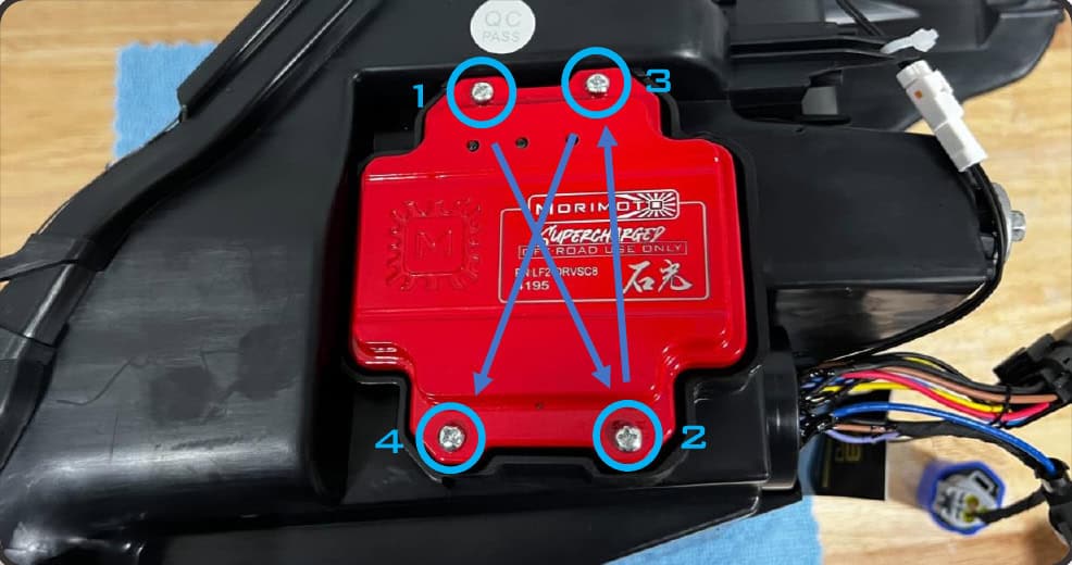 2016–2023 Tacoma Morimoto Evo Headlight Installation Guide 25 Grease and seat the seal, then tighten the four screws evenly.