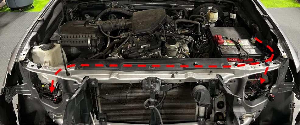 2016–2023 Tacoma Morimoto Evo Headlight Installation Guide 35 Route the short branch to the driver side and the long branch across the radiator support.