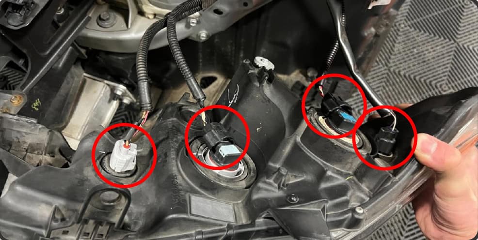 2016–2023 Tacoma Morimoto Evo Headlight Installation Guide 17 Disconnect the original lamp connectors; equipment differs.