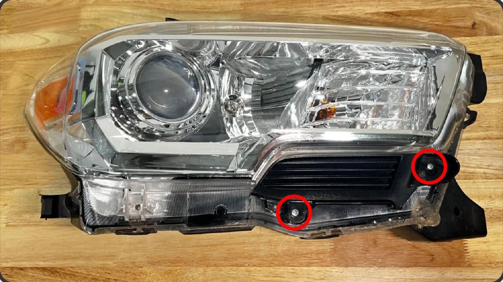 2016–2023 Tacoma Morimoto Evo Headlight Installation Guide 18 Remove the two screws retaining the lower trim.