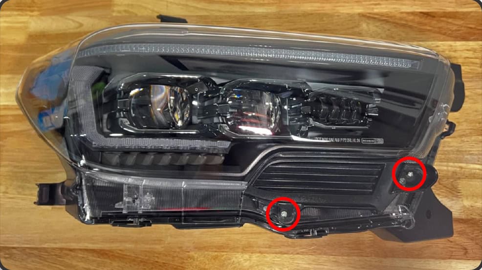 2016–2023 Tacoma Morimoto Evo Headlight Installation Guide 19 Transfer the trim to the new assembly using supplied screws.