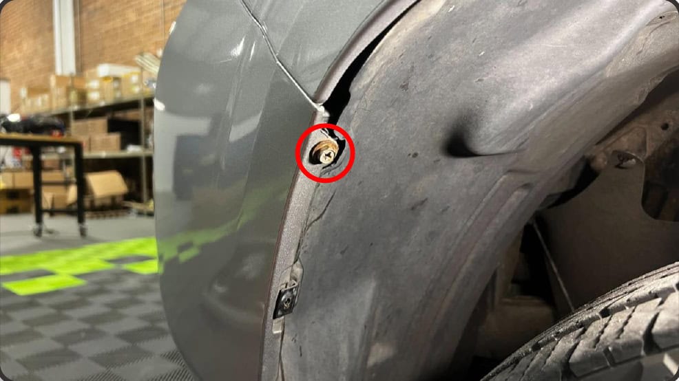 2016–2023 Tacoma Morimoto Evo Headlight Installation Guide 9 Remove the wheel-well bolt.