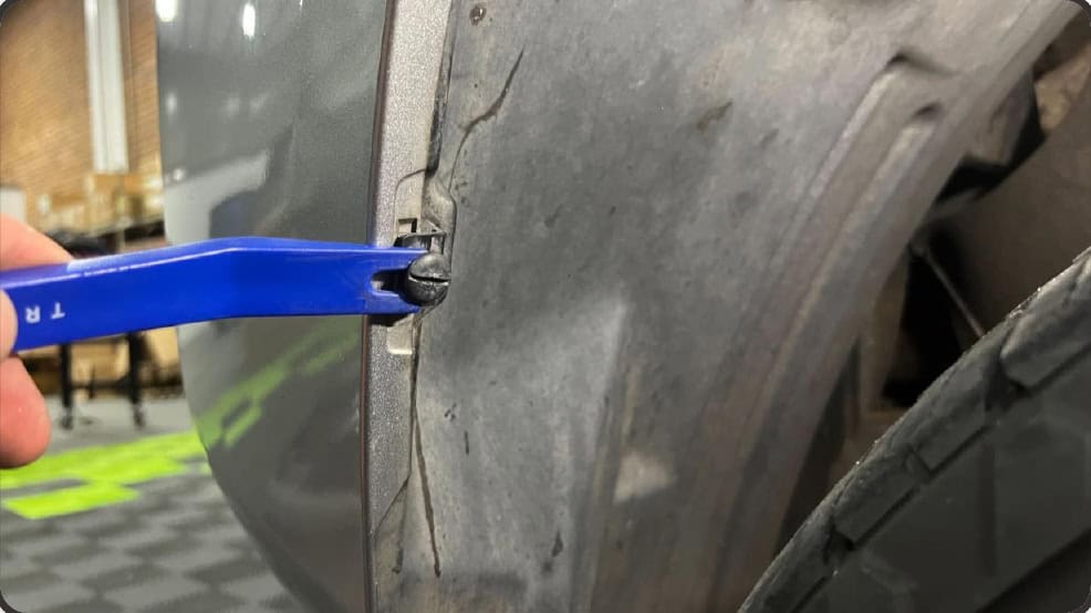 2016–2023 Tacoma Morimoto Evo Headlight Installation Guide 8 Turn the plastic wheel-well retainer to its release position.