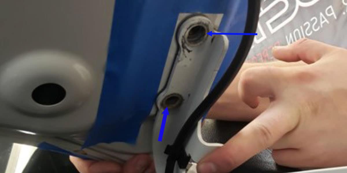 2016–2023 Toyota Tacoma Ditch Light Installation Guide 2 Keep the hood supported while removing the two hinge bolts.