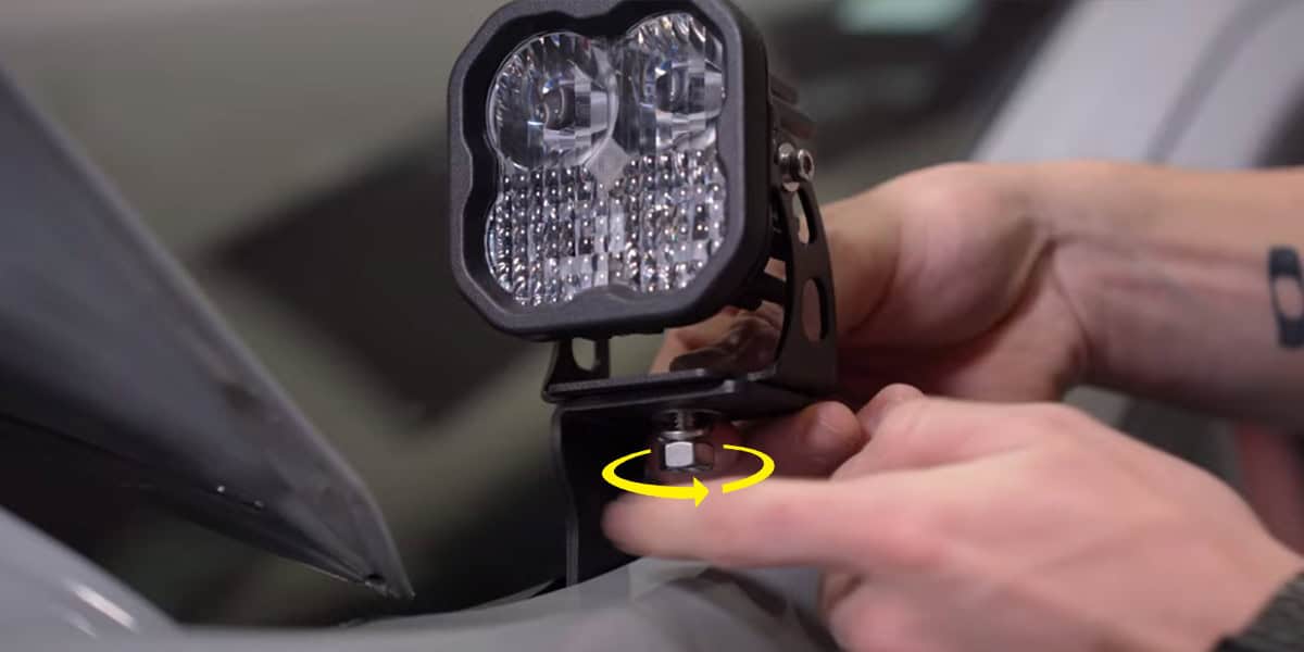 2016–2023 Toyota Tacoma Ditch Light Installation Guide 16 Original mounting photograph shows the lamp attached above the vehicle bracket.