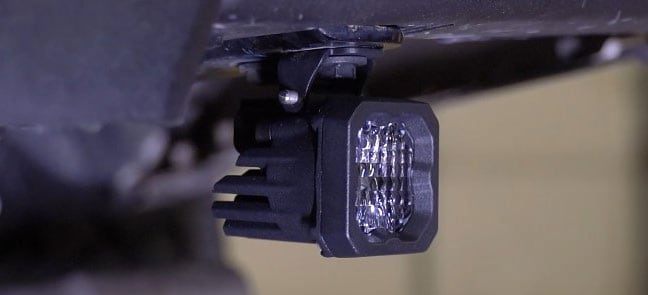 2016–2023 Toyota Tacoma Reverse Light Installation Guide 3 Manufacturer C1 example mounted under the bumper; follow the matching hardware for your pod.