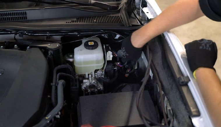 2016–2023 Toyota Tacoma Reverse Light Installation Guide 10 Manufacturer example of routing from the engine bay toward the switch location.