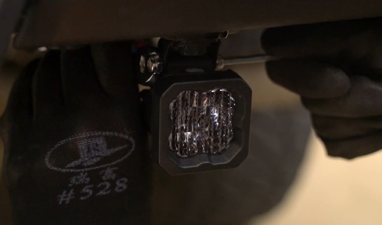 2016–2023 Toyota Tacoma Reverse Light Installation Guide 12 Connect the pod harness and route it clear of the lamp mounting hardware.