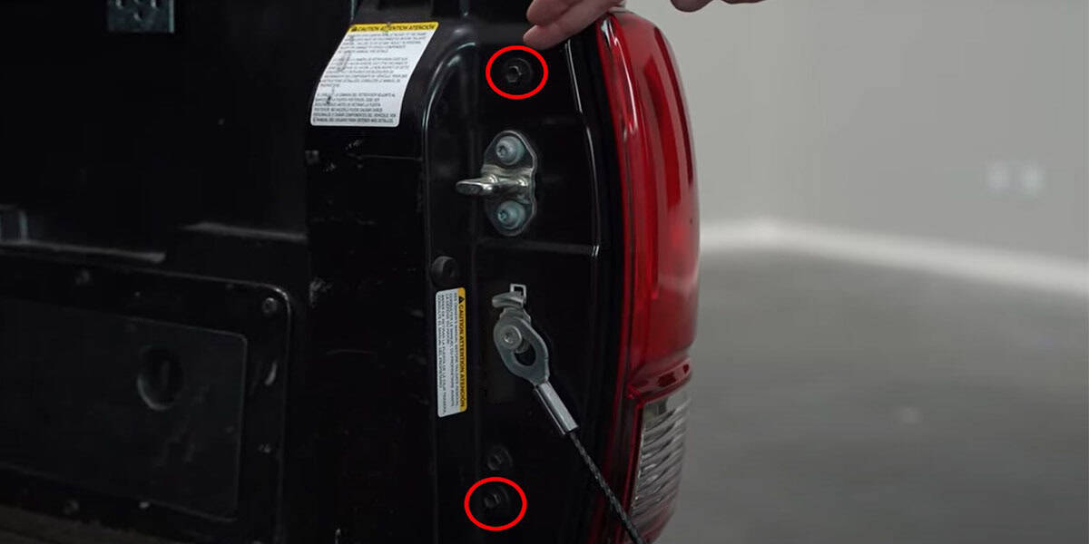 2016–2023 Tacoma Form Tail-Light Installation Guide 1 The two 10mm mounting bolts are accessible with the tailgate lowered.