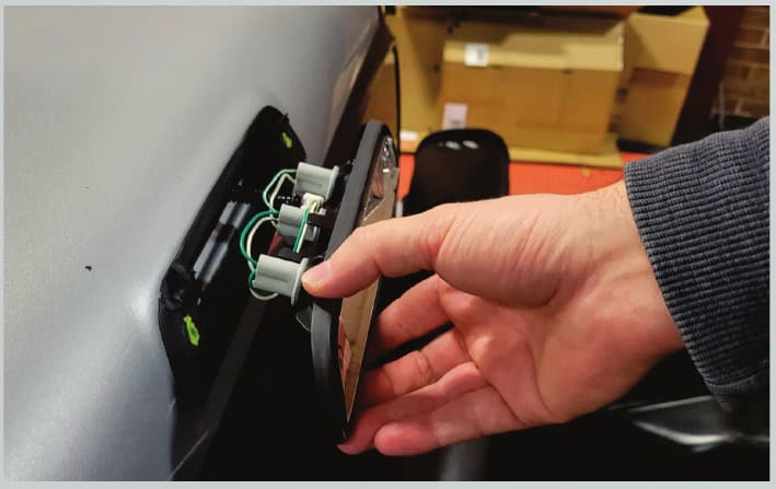 Toyota Tacoma Morimoto X3B Third Brake-Light Installation Guide 5 Unplug the original lamp after releasing the seal.