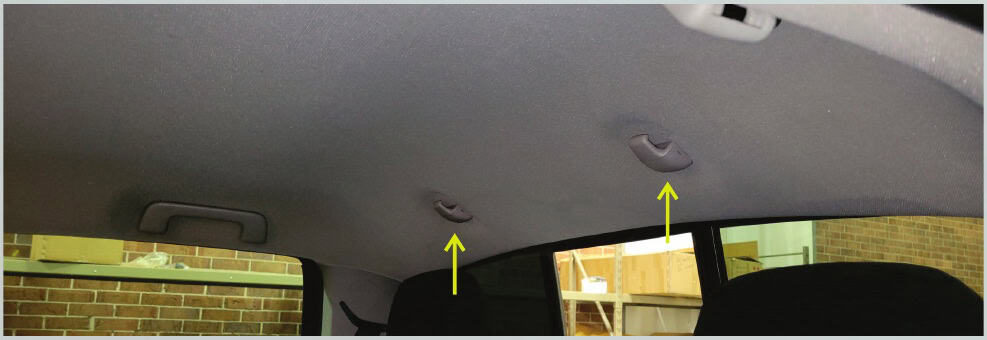 Toyota Tacoma Morimoto X3B Third Brake-Light Installation Guide 7 Find the two rear headliner hangers beside the rear window.