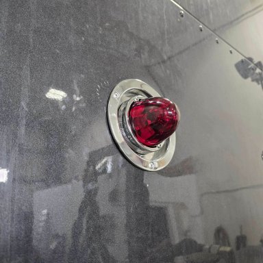 Red Glass is Class watermelon lights with Alpha Series Lighting recessed bunk adapter buckets installed on a 2023 Kenworth W990